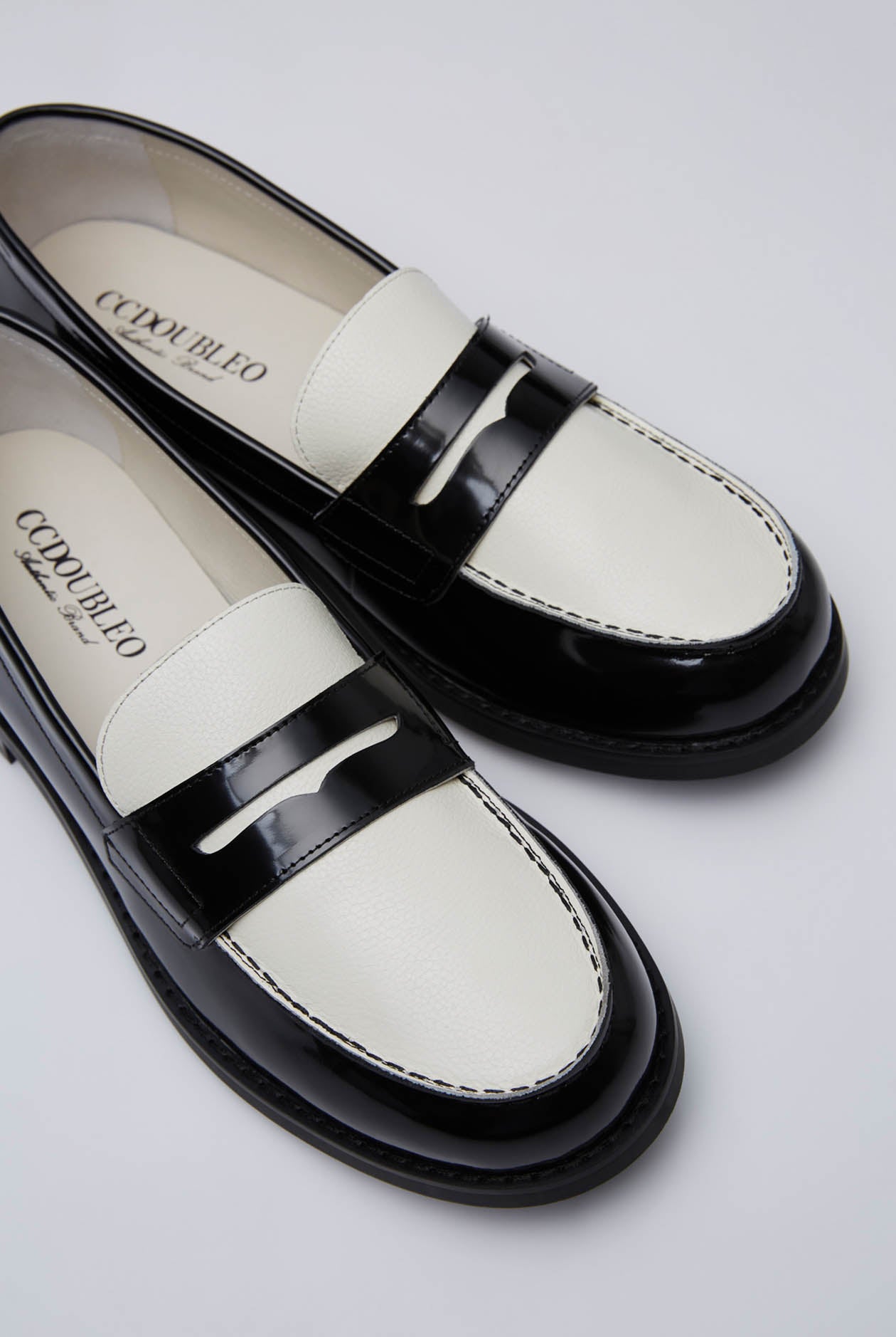 BLACK AND WHITE PENNY LOAFERS
