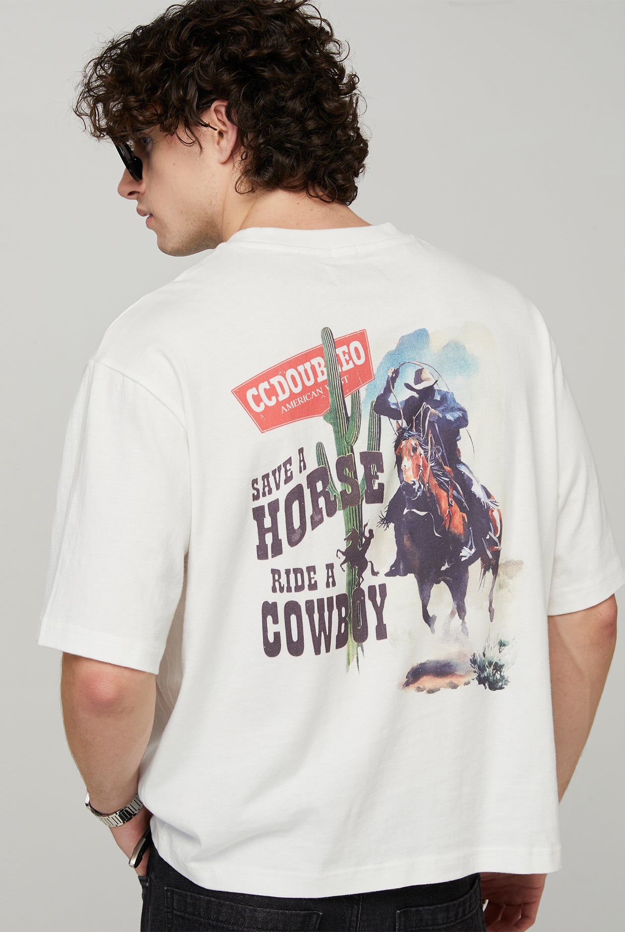 RIDES A COWBOY TEE
