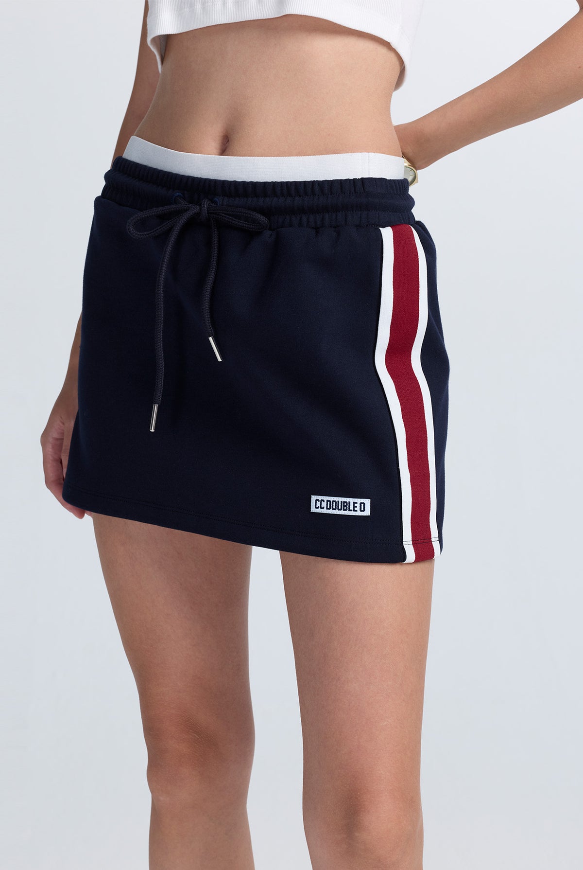 LAYERED-WAIST TRACK SKIRT WITH CONTRAST TAPE